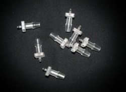 Bellco Glass, Inc. Clear poly-carbonate singled barbed tube fitting. Tubing